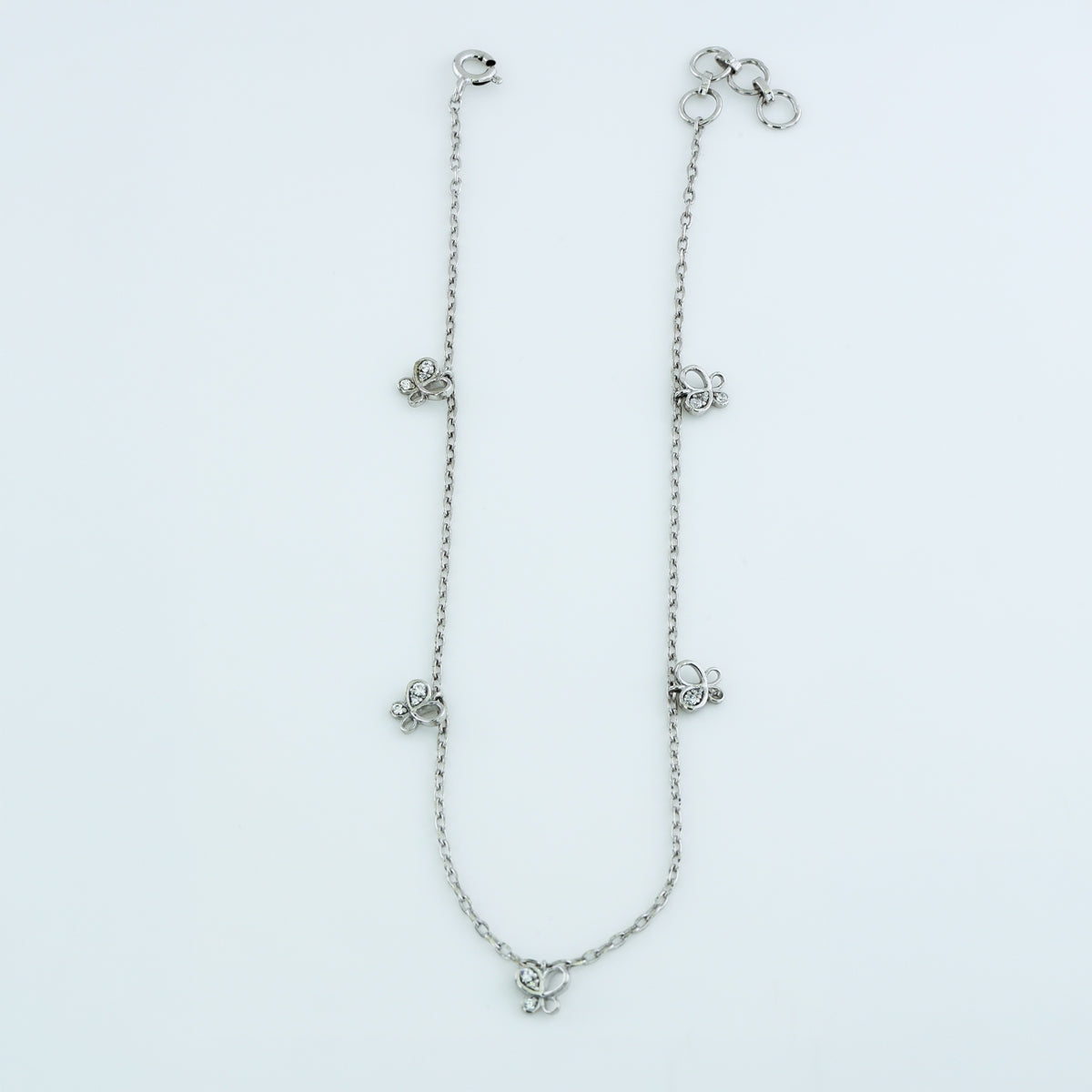 Butterfly charm anklet with delicate chain and five dangling butterfly shaped stone charms