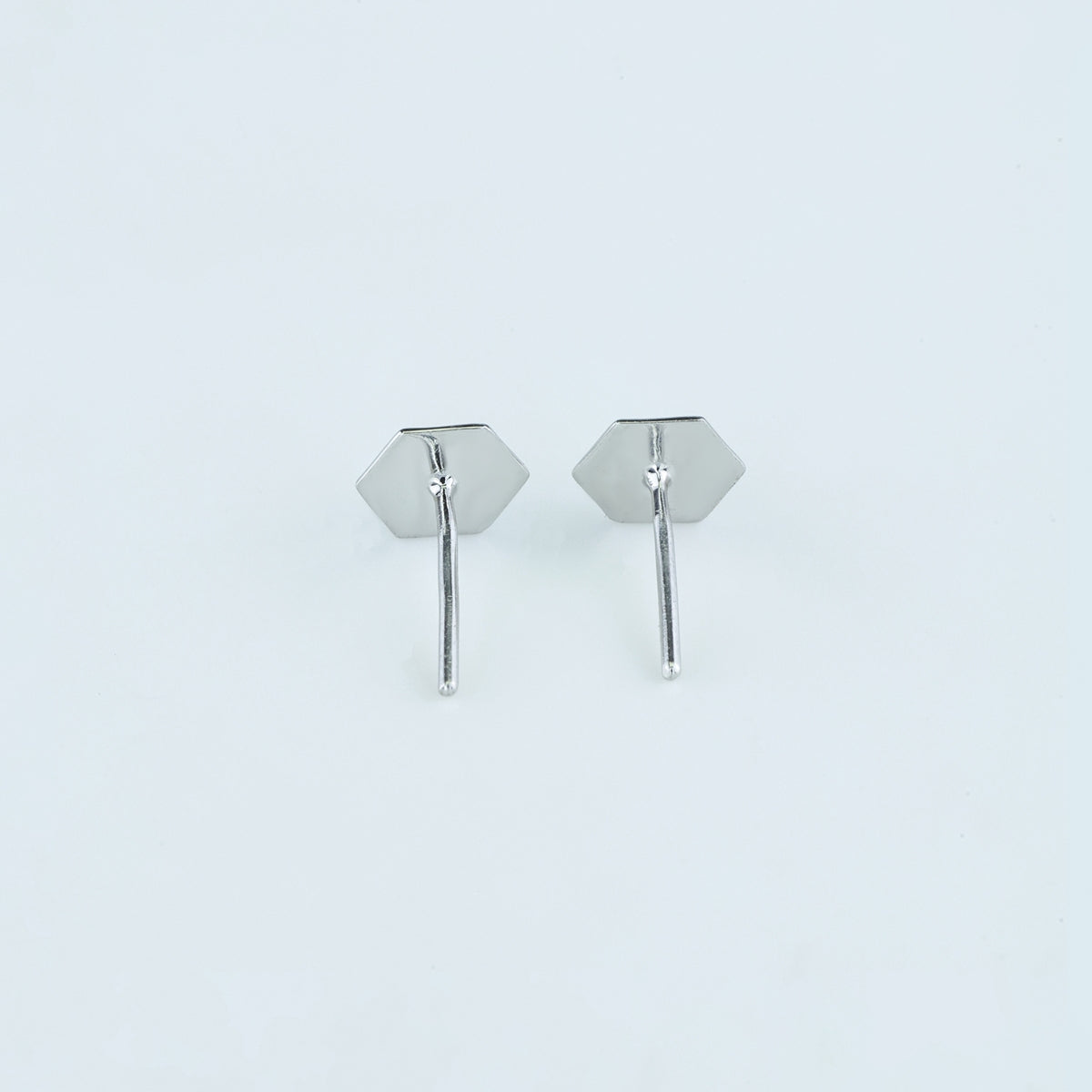 Hexa pyramid stud earrings with hexagonal base and multi-faceted geometric peak