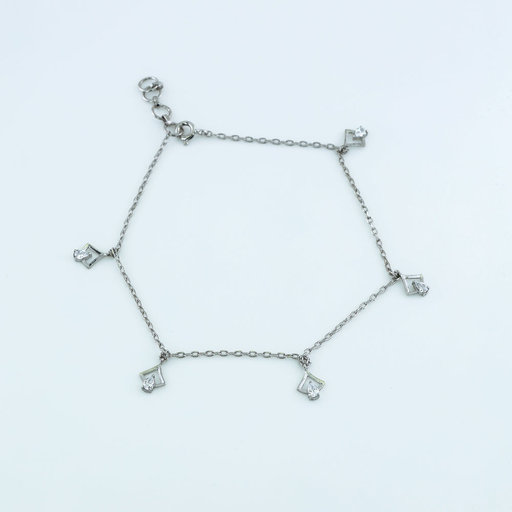 Arrow drop charm anklet with delicate chain and five dangling arrow shaped pear stone charms