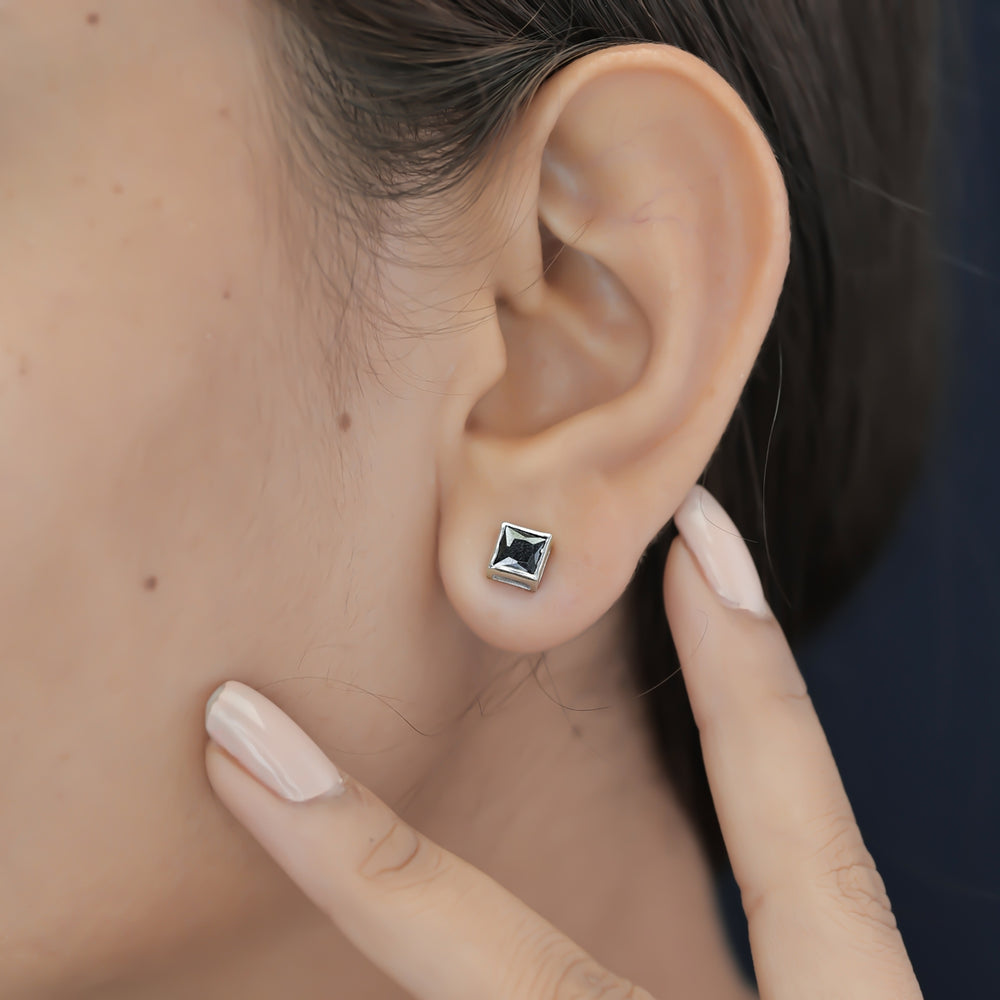 Black princess bezel stud earrings with channel set flat square frame