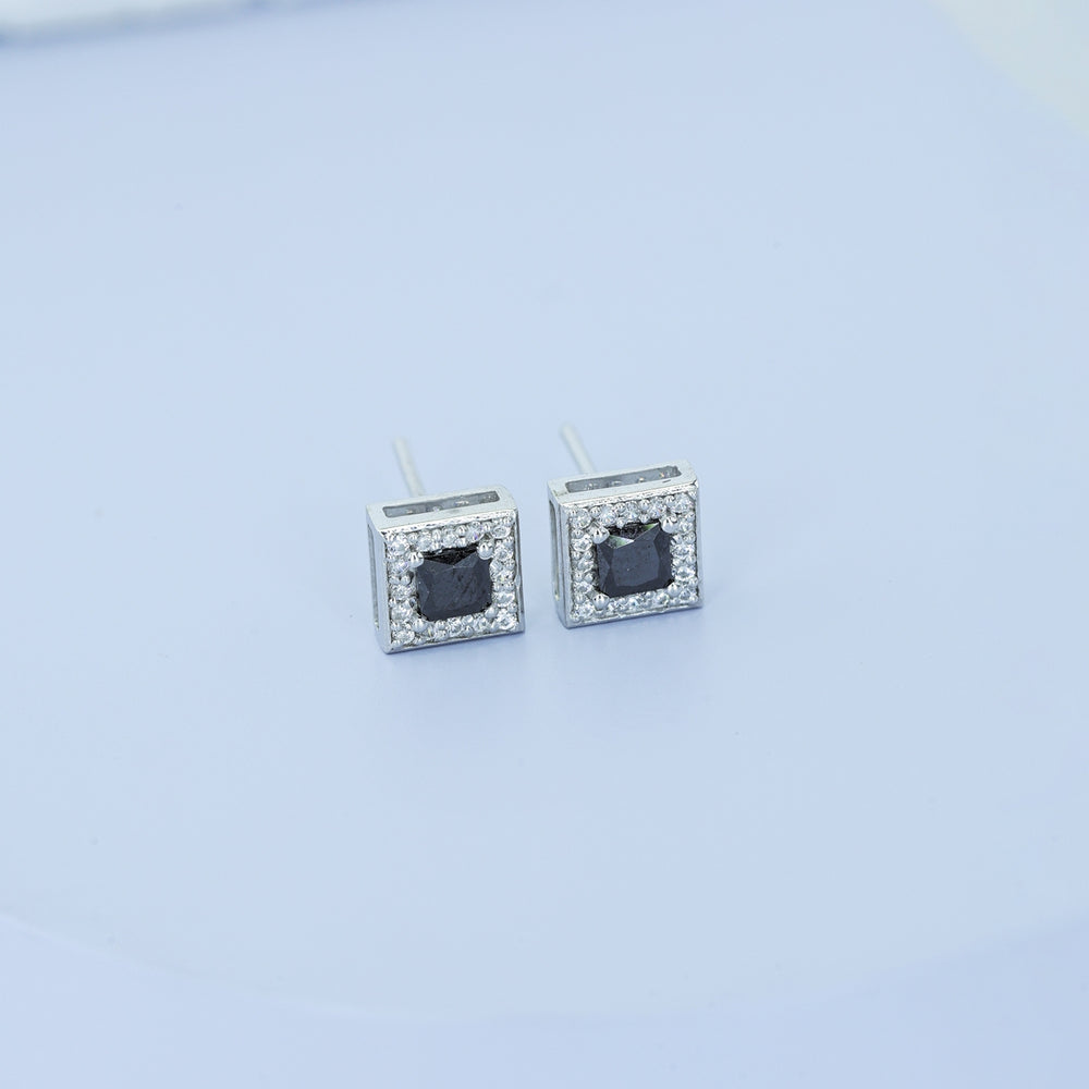 Black princess halo square stud earrings with white pave border and tilted diamond frame