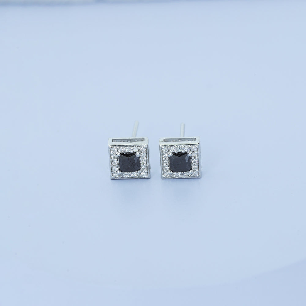Black princess halo square stud earrings with white pave border and tilted diamond frame
