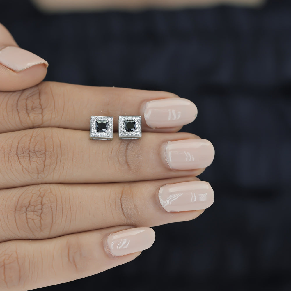 Black princess halo square stud earrings with white pave border and tilted diamond frame