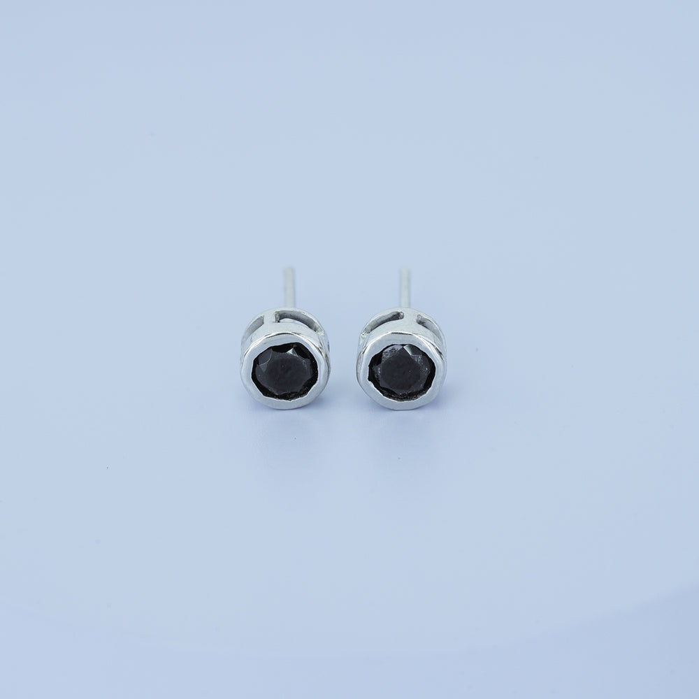 Black round stud earrings with polished circular bezel frame