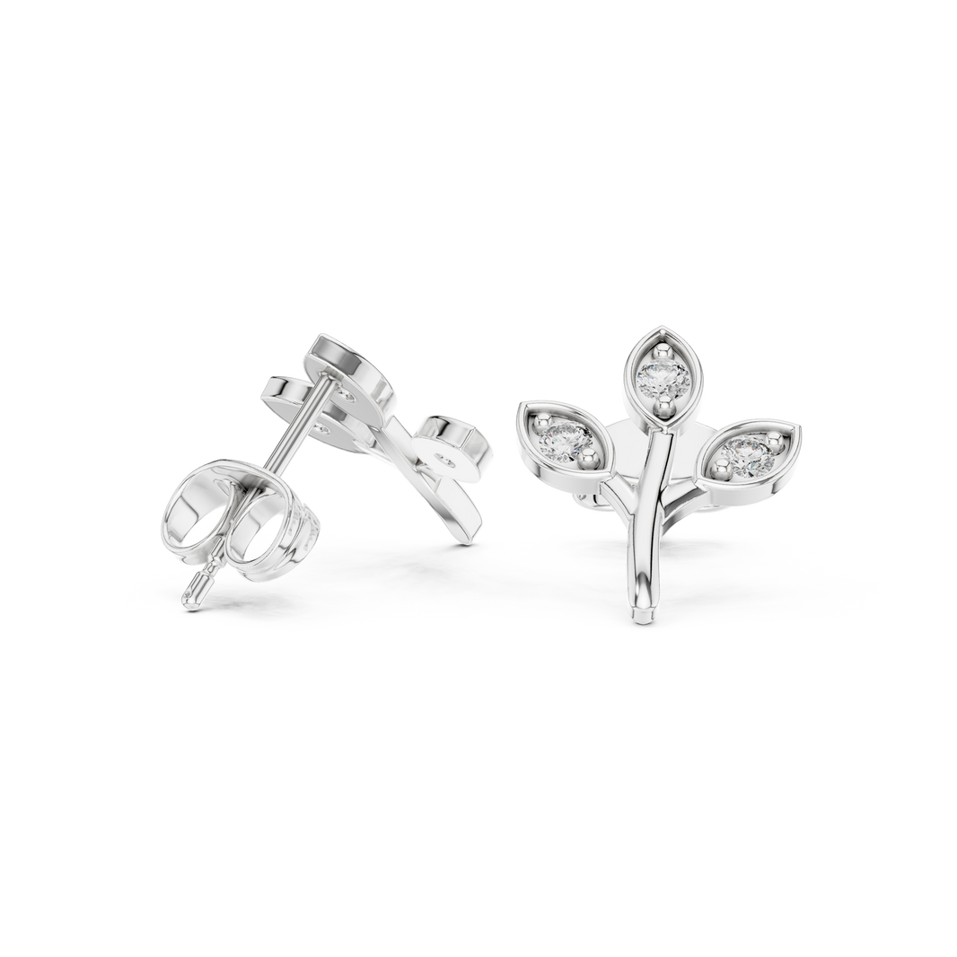 Branch-shaped stud earrings with three marquise-framed bezel-set round brilliant stones on polished leaf motifs