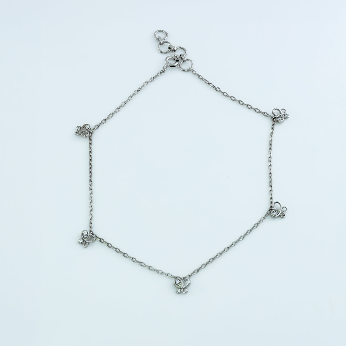 Butterfly charm anklet with delicate chain and five dangling butterfly shaped stone charms