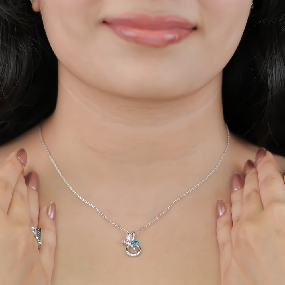 Silver chain necklace with a crescent pendant set with pink and blue stones