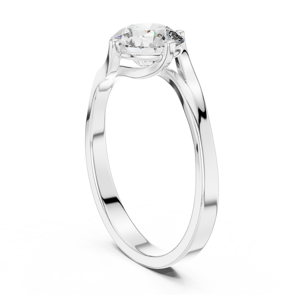 Bypass twist solitaire diamond engagement ring with round brilliant cut stone