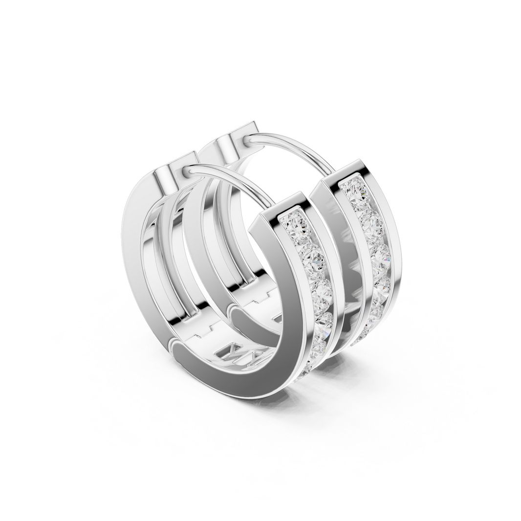 Channel set round stone huggie earrings with wide polished band and single row of channel set round stones along the centre