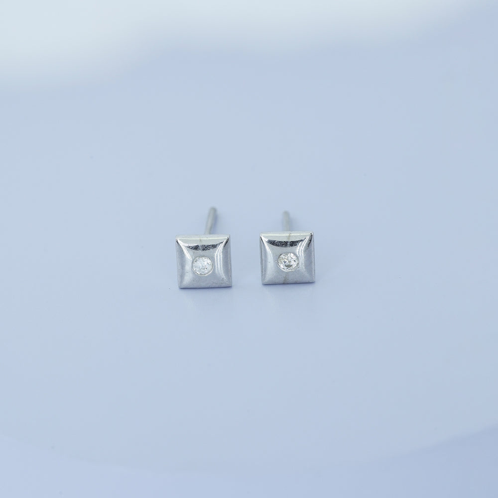 Chaukor stud earrings with diamond-shaped geometric frame and bezel-set round centre stone