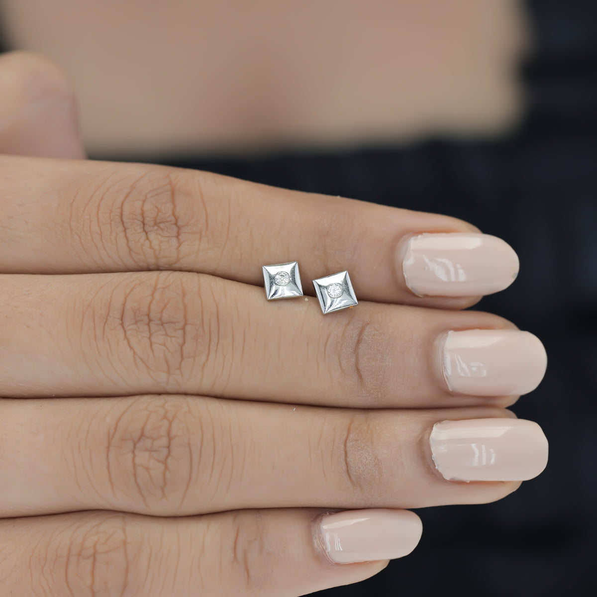 Chaukor stud earrings with diamond-shaped geometric frame and bezel-set round centre stone