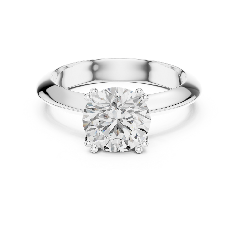 Classic round solitaire engagement ring with six prong cathedral setting and plain tapered band