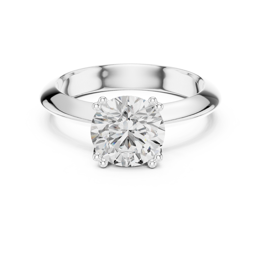Classic round solitaire engagement ring with six prong cathedral setting and plain tapered band