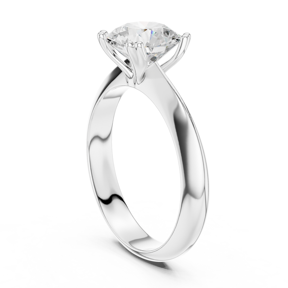 Classic round solitaire engagement ring with six prong cathedral setting and plain tapered band