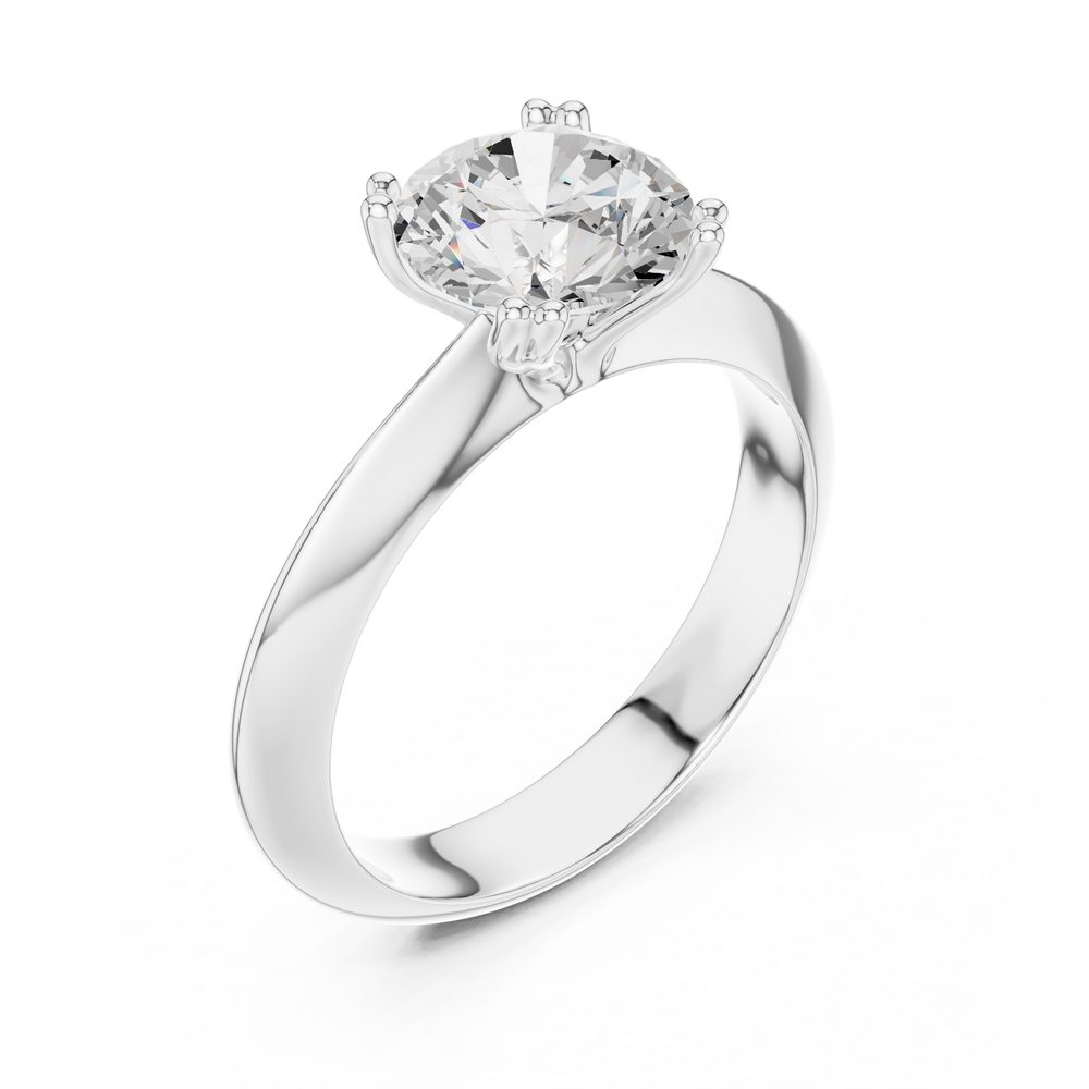 Classic round solitaire engagement ring with six prong cathedral setting and plain tapered band
