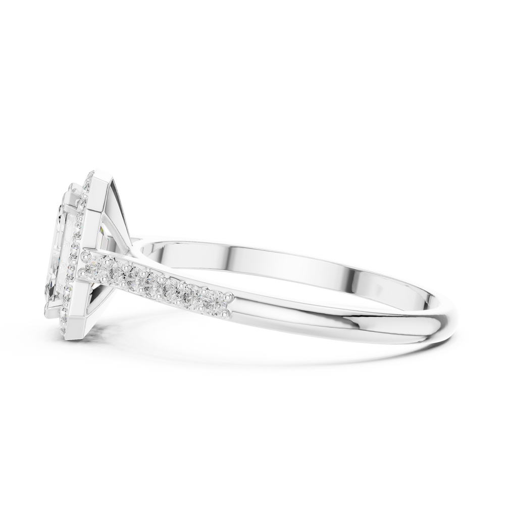 Emerald cut halo engagement ring with pave set shoulders and tapered split band