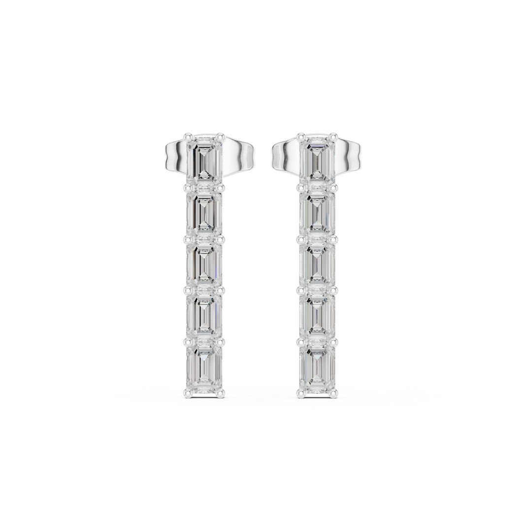 Six emerald cut stones stacked vertically in a long linear bar drop earring