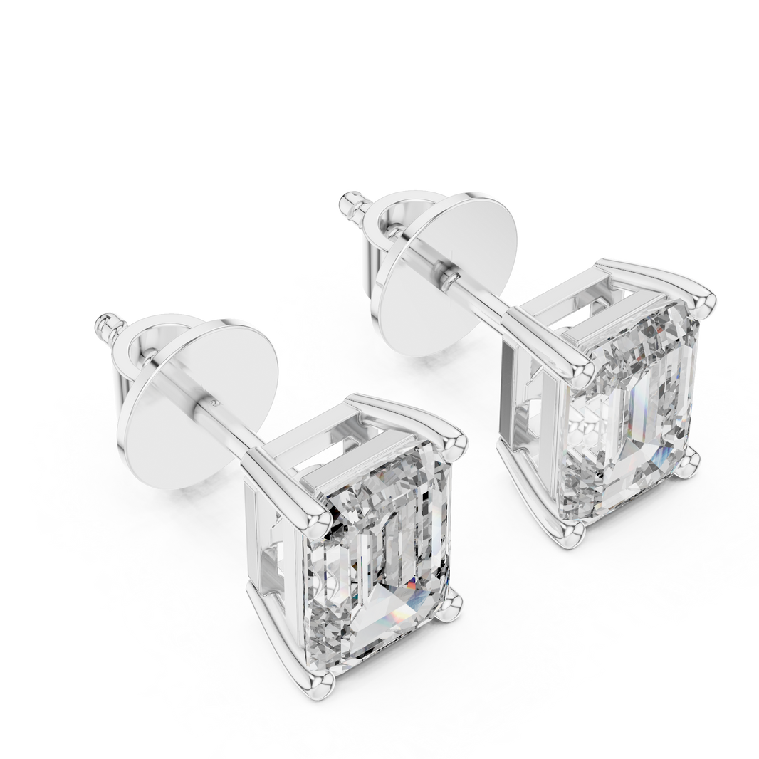 Emerald cut solitaire stud earrings with a four-corner claw setting