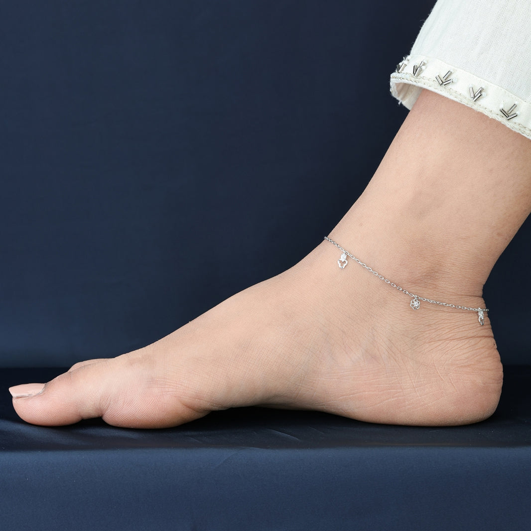 Floral and pear drop charm anklet with delicate chain and alternating flower and pear shaped dangling charms