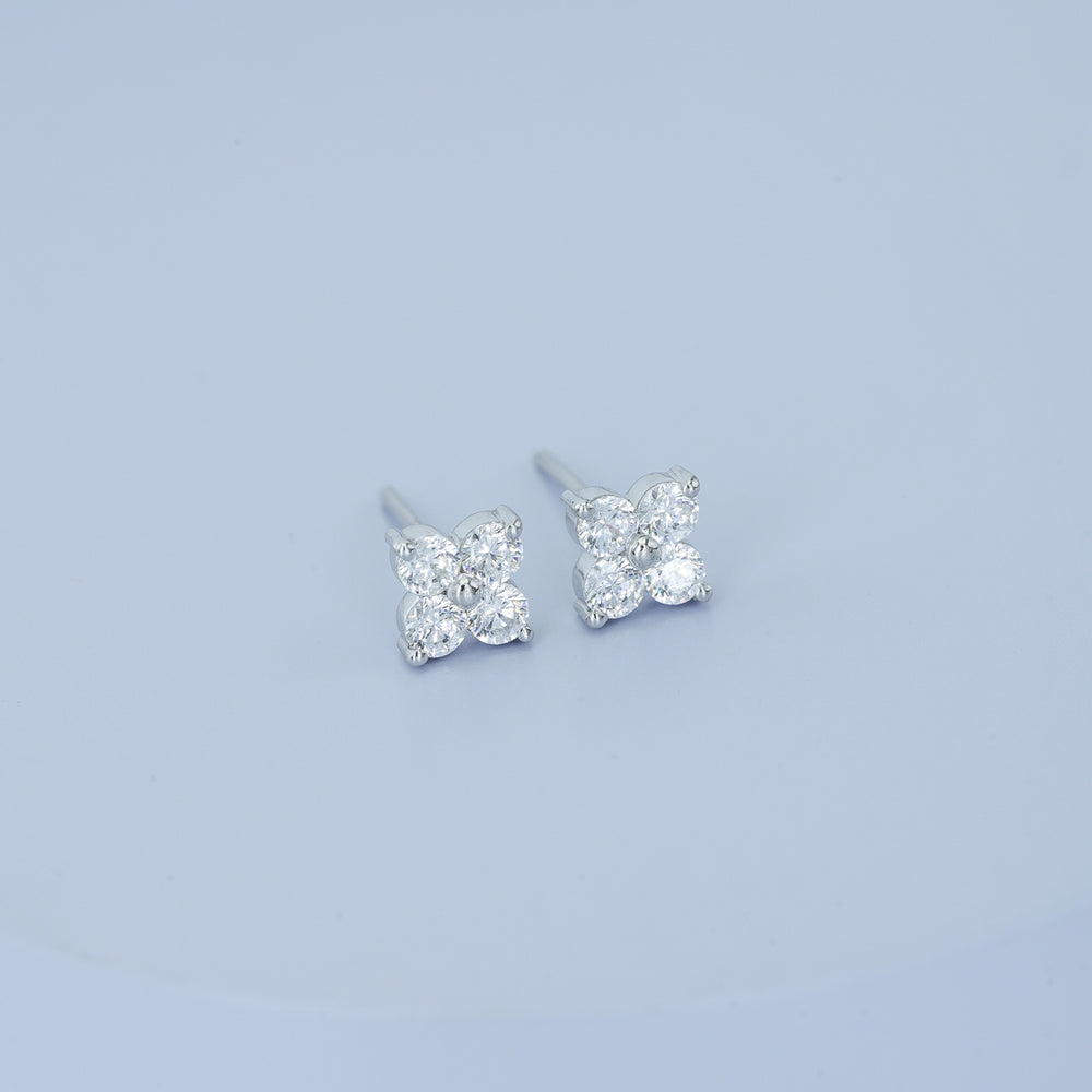 Floral diamond stud earrings with five round stones in flower cluster arrangement
