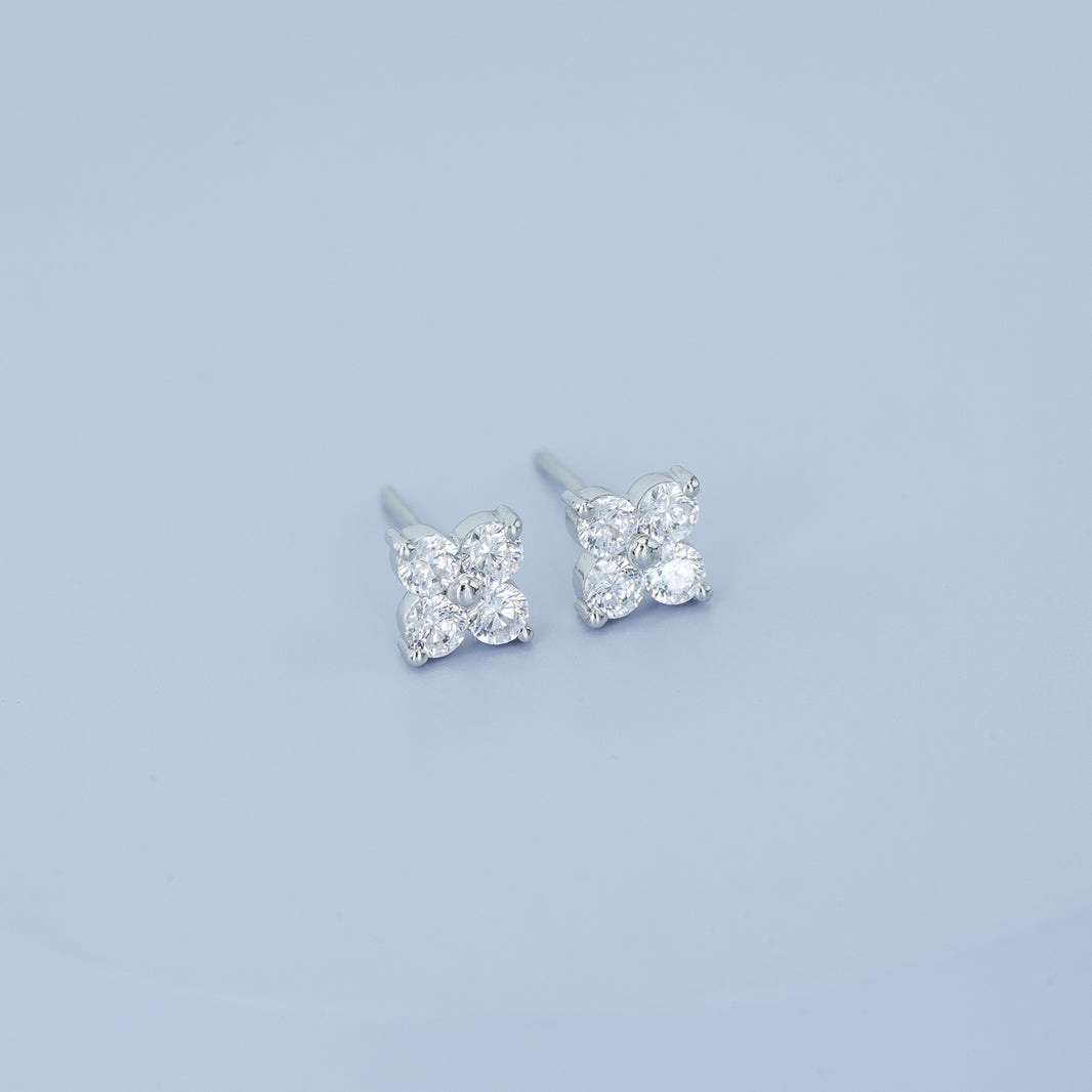 Floral diamond stud earrings with five round stones in flower cluster arrangement