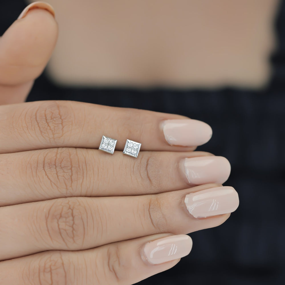 Four stone square cluster stud earrings with tilted diamond shape flat frame