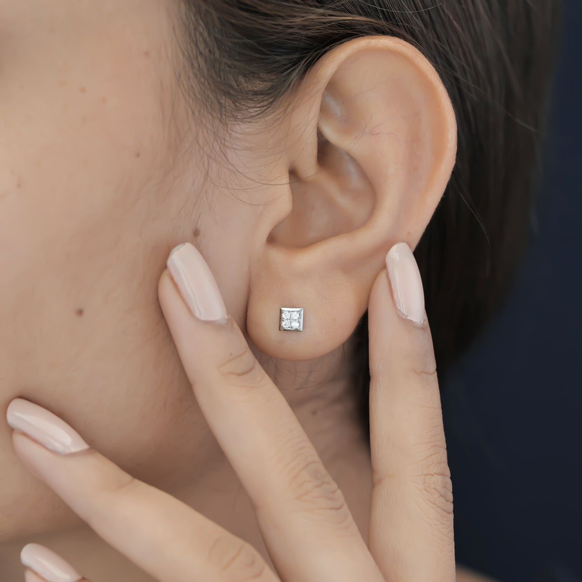 Four stone square cluster stud earrings with tilted diamond shape flat frame