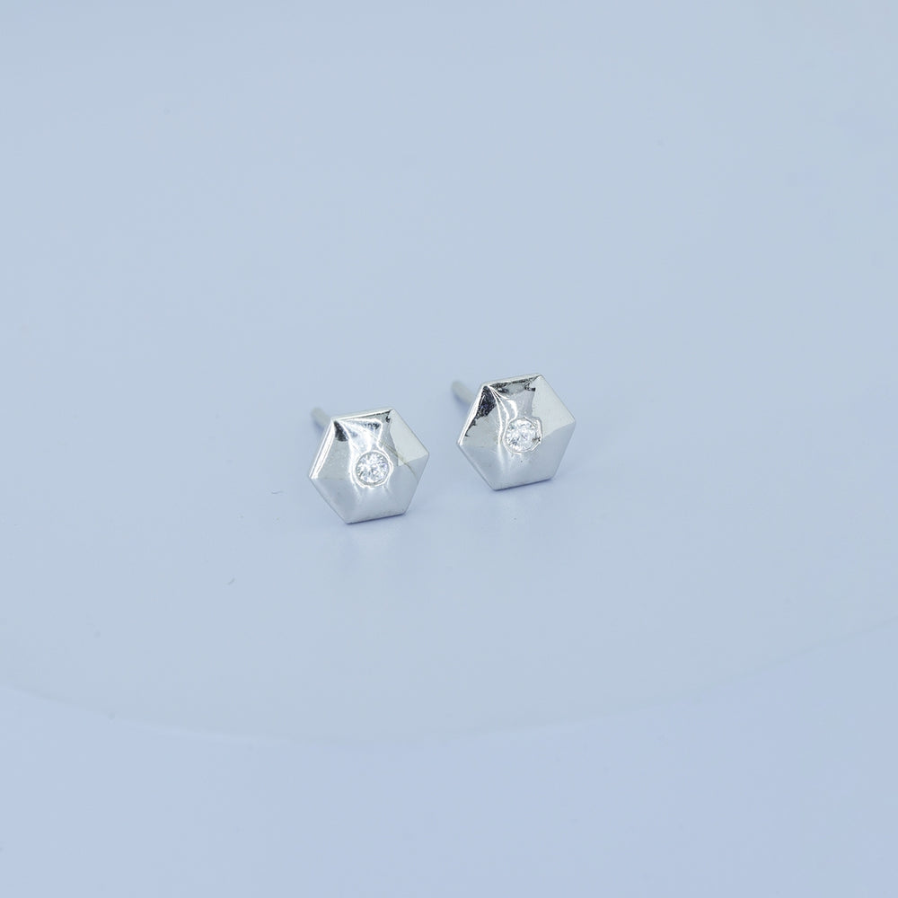 Geometric cube solitaire stud earrings with hexagonal frame and round centre stone