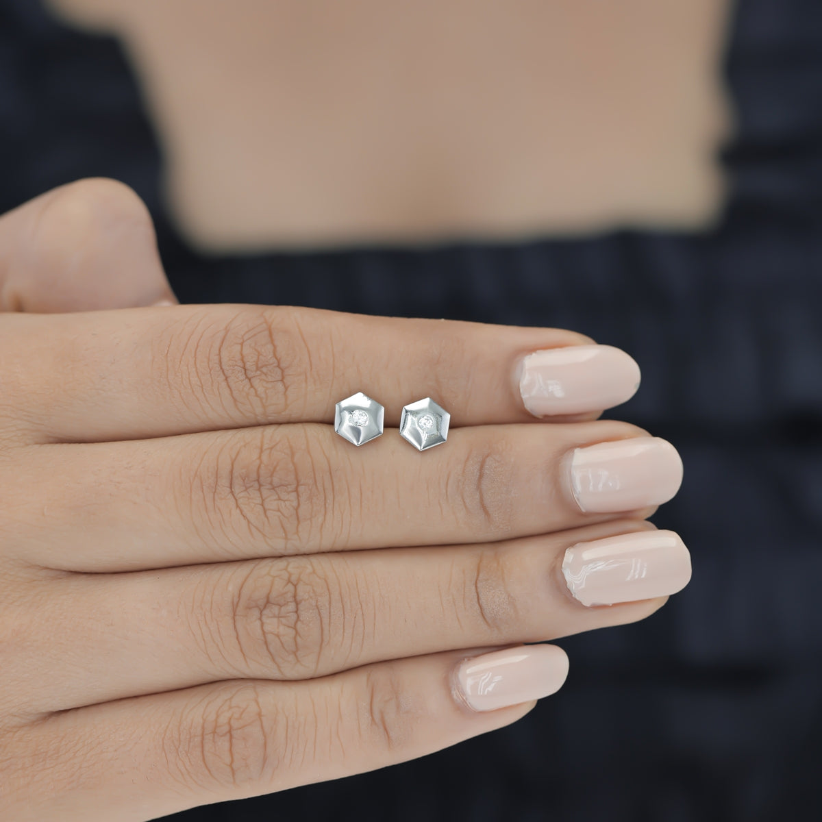 Geometric cube solitaire stud earrings with hexagonal frame and round centre stone