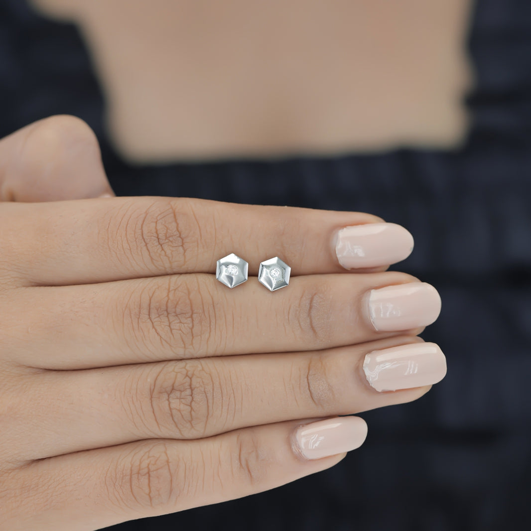 Geometric cube solitaire stud earrings with hexagonal frame and round centre stone