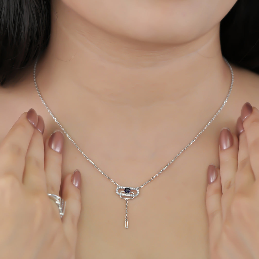 Delicate necklace featuring a pavé oval frame centered with a dark crystal drop