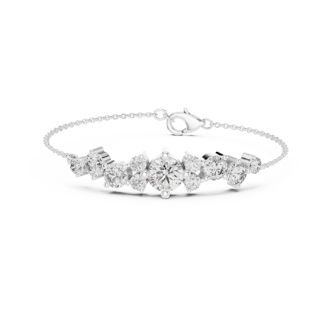 Graduating cluster chain bracelet with baguette and round stone centre detailing