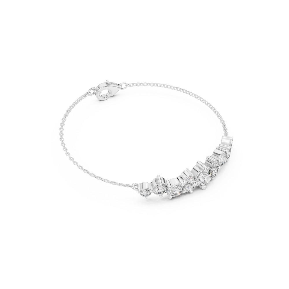 Graduating cluster chain bracelet with baguette and round stone centre detailing
