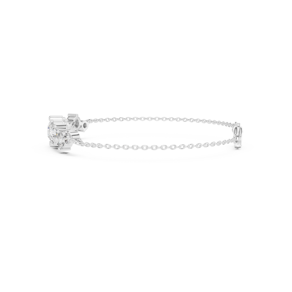 Graduating cluster chain bracelet with baguette and round stone centre detailing