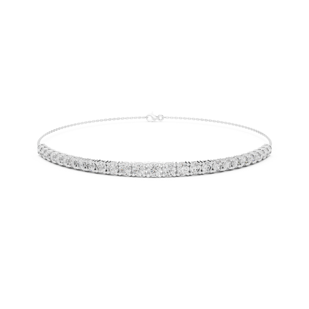 Graduating cluster chain bracelet with baguette and round stone centre detailing