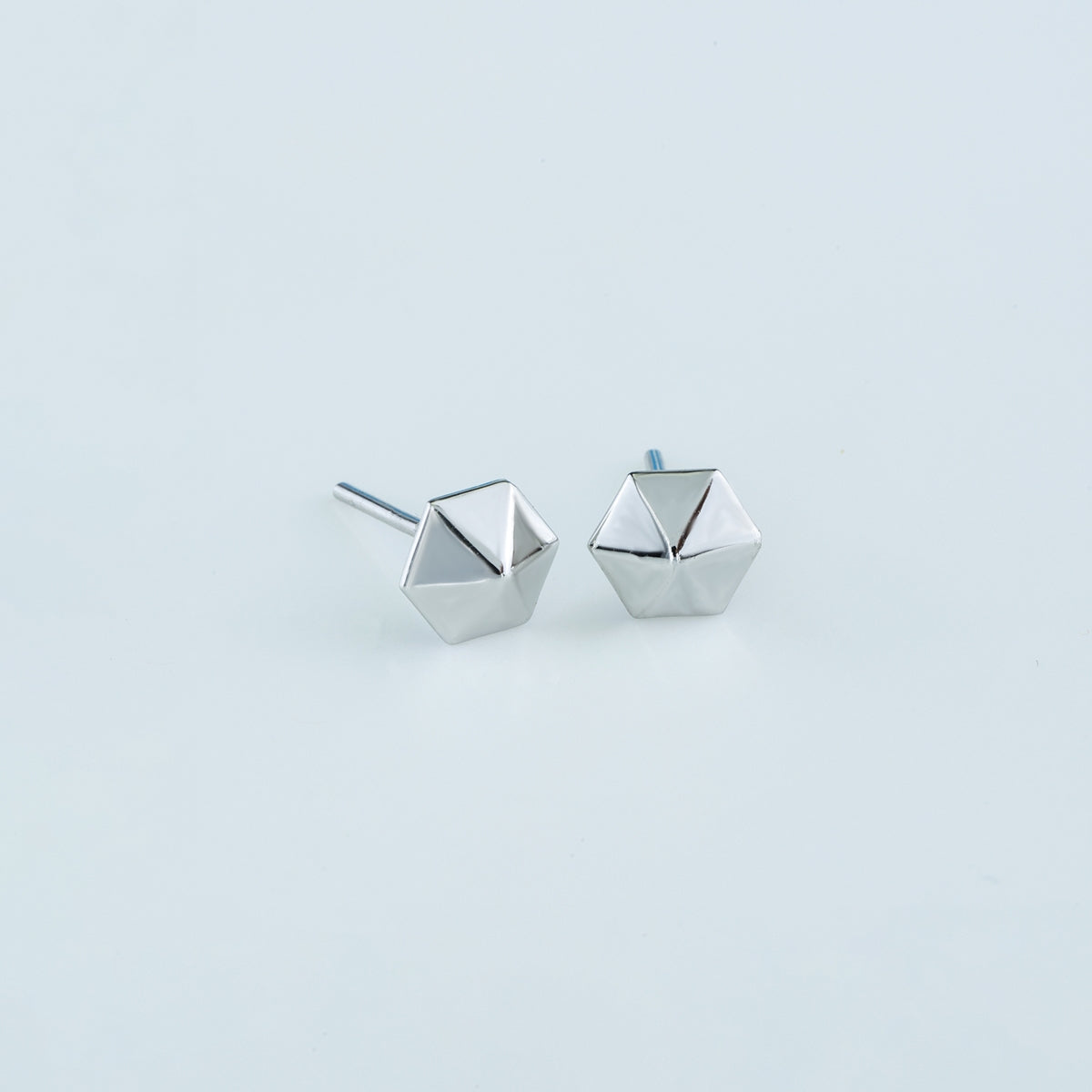 Hexa pyramid stud earrings with hexagonal base and multi-faceted geometric peak
