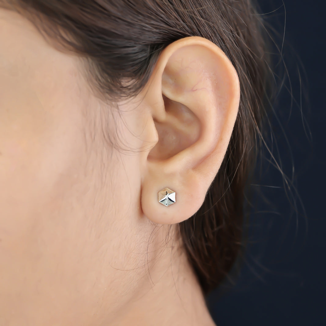 Hexa pyramid stud earrings with hexagonal base and multi-faceted geometric peak