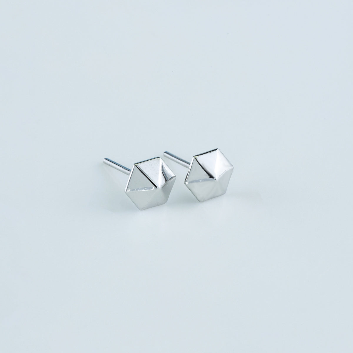 Hexa pyramid stud earrings with hexagonal base and multi-faceted geometric peak