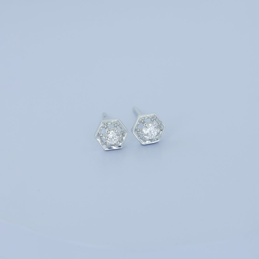 Hexagon stud earrings with geometric frame and raised round centre