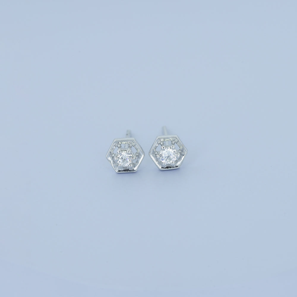 Hexagon stud earrings with geometric frame and raised round centre