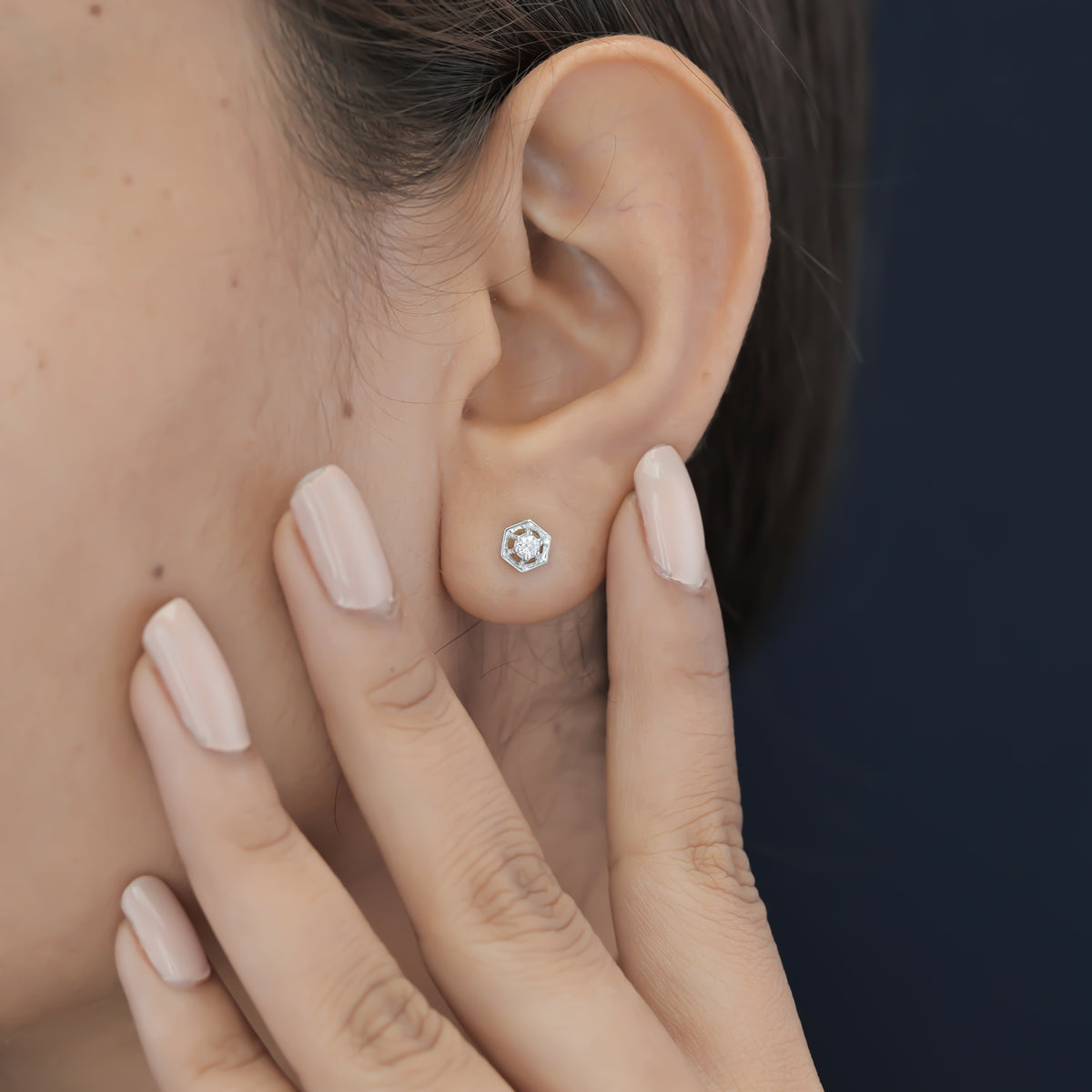 Hexagon stud earrings with geometric frame and raised round centre