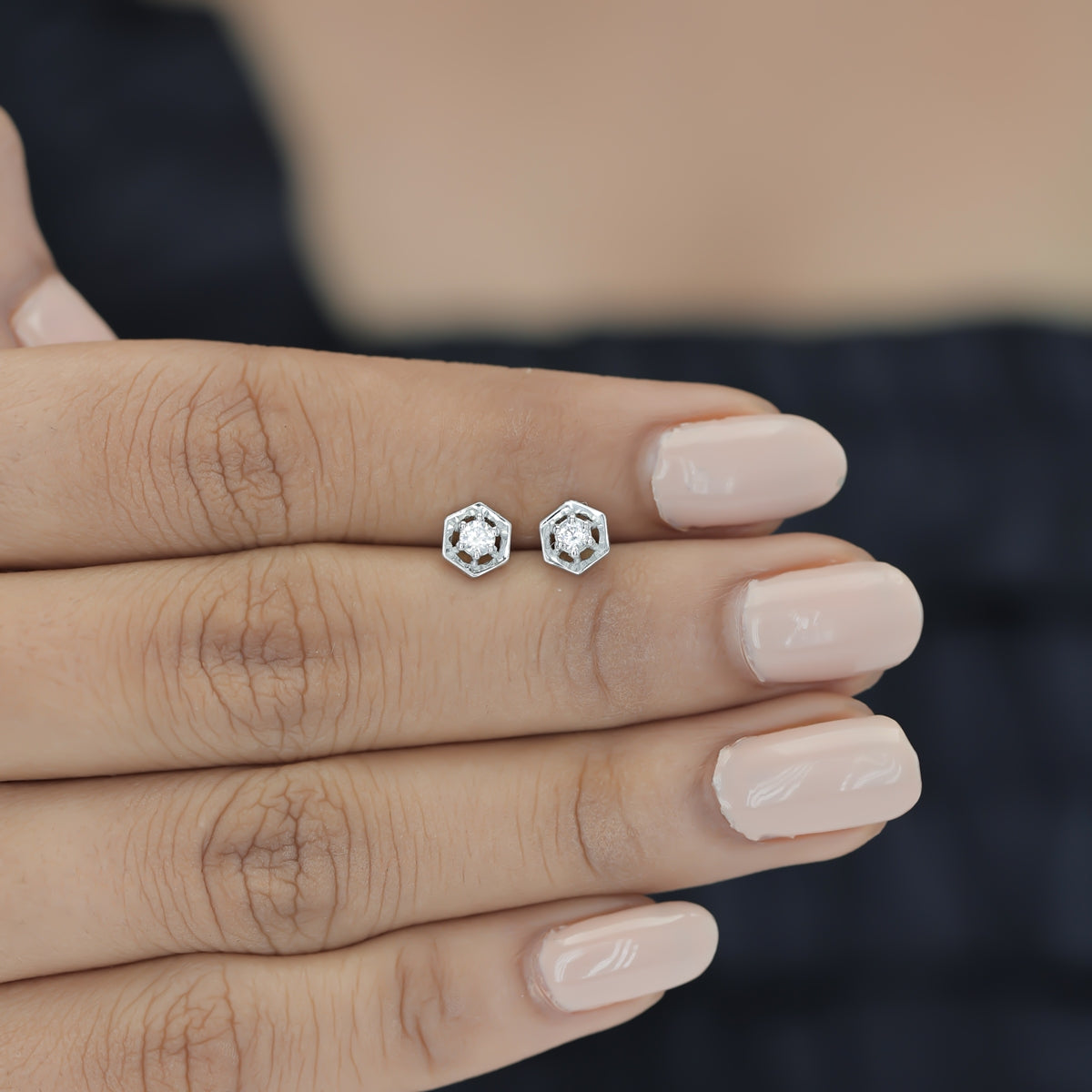 Hexagon stud earrings with geometric frame and raised round centre