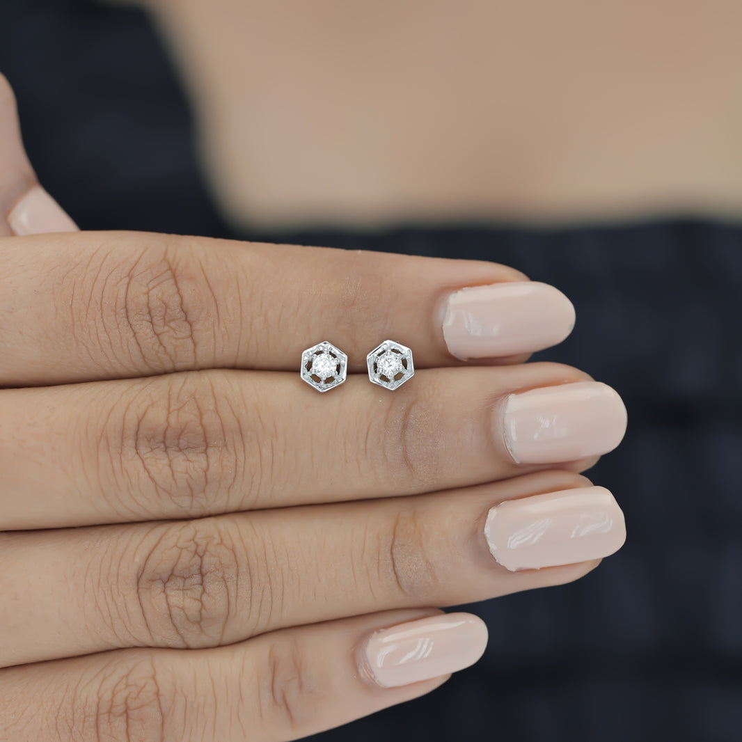 Hexagon stud earrings with geometric frame and raised round centre