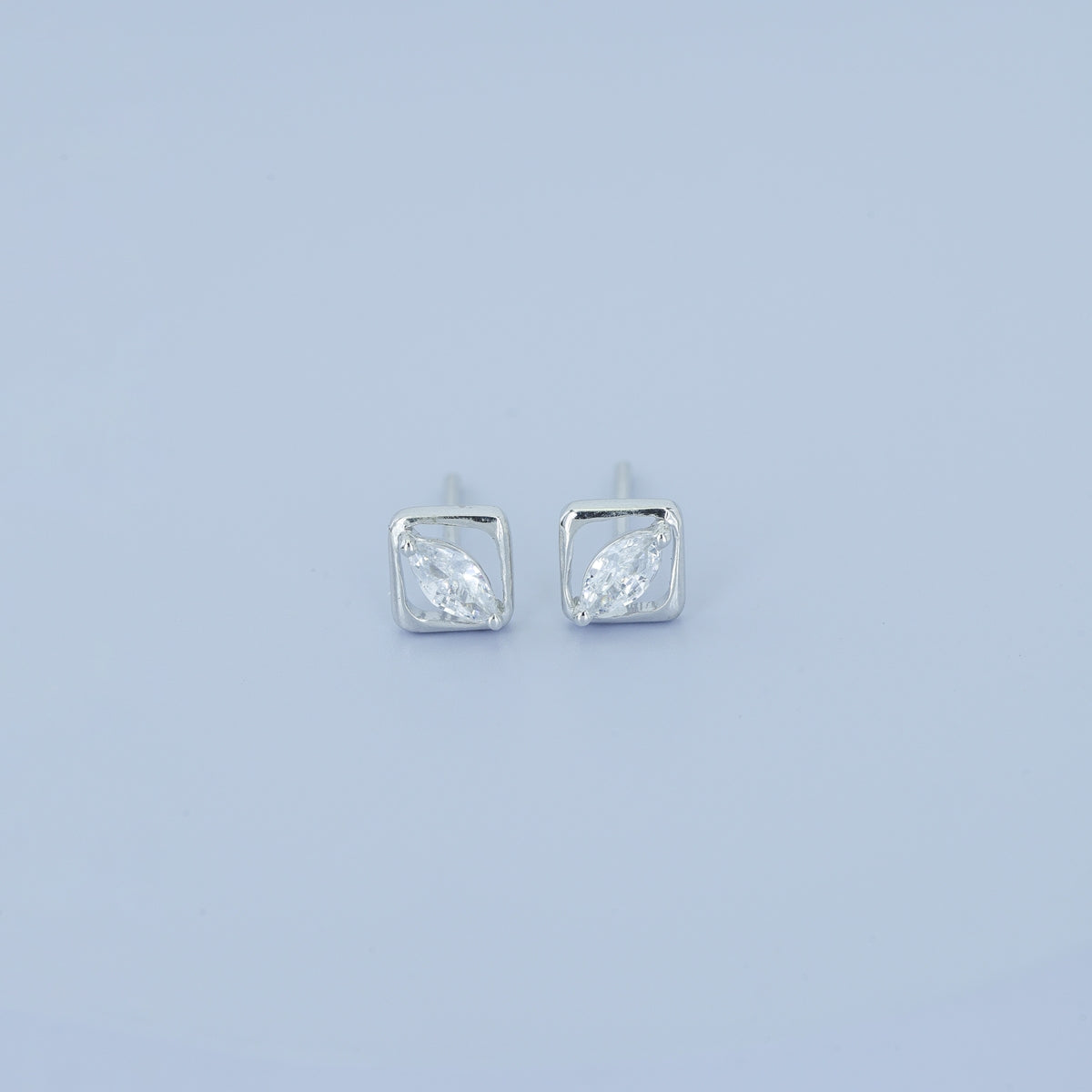 Marquise stud earrings with tilted square open frame border