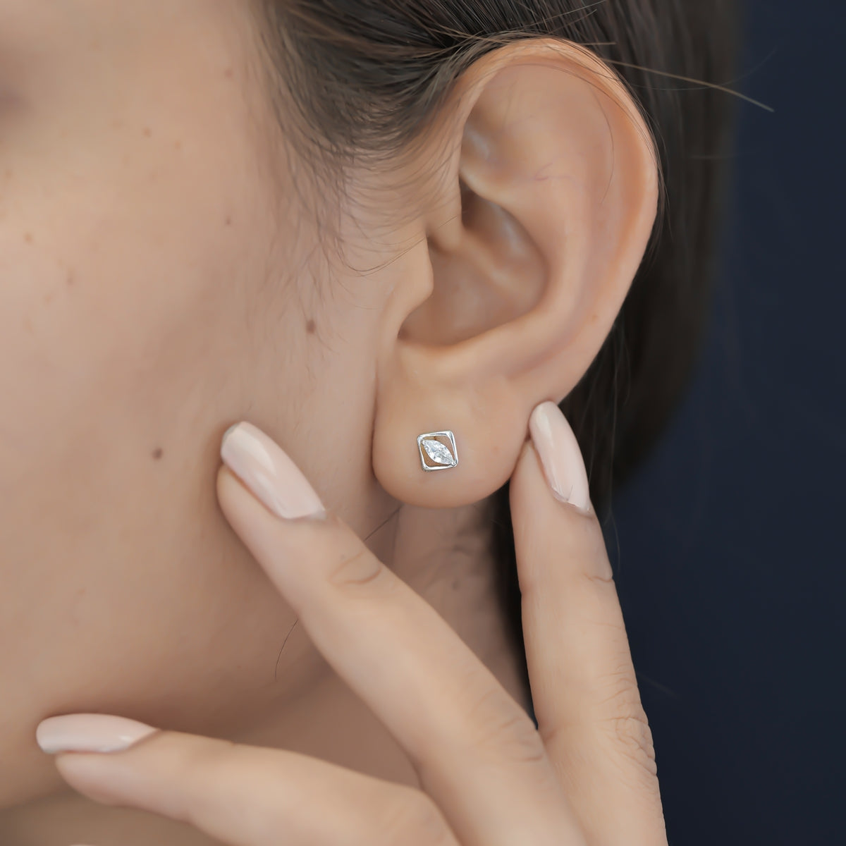 Marquise stud earrings with tilted square open frame border