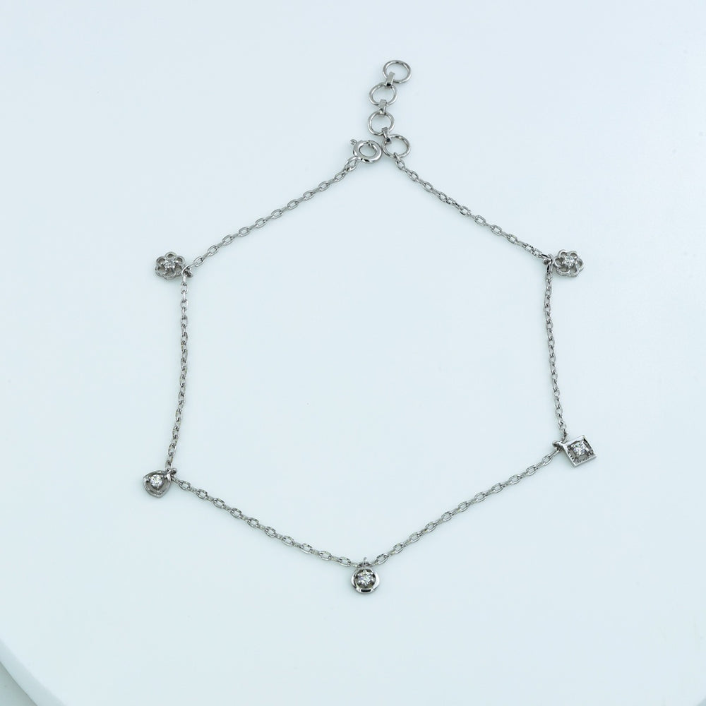 Mixed shape charm anklet with delicate chain and five varied geometric round stone station charms