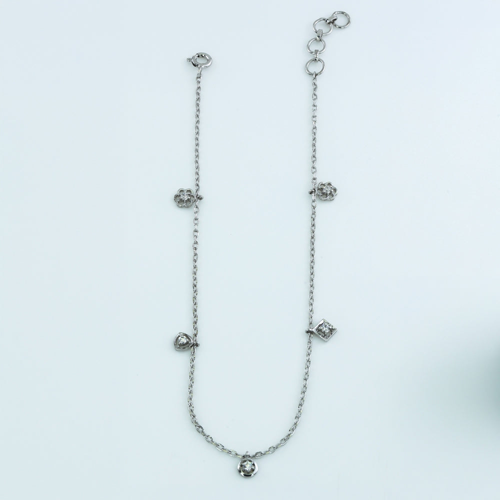 Mixed shape charm anklet with delicate chain and five varied geometric round stone station charms