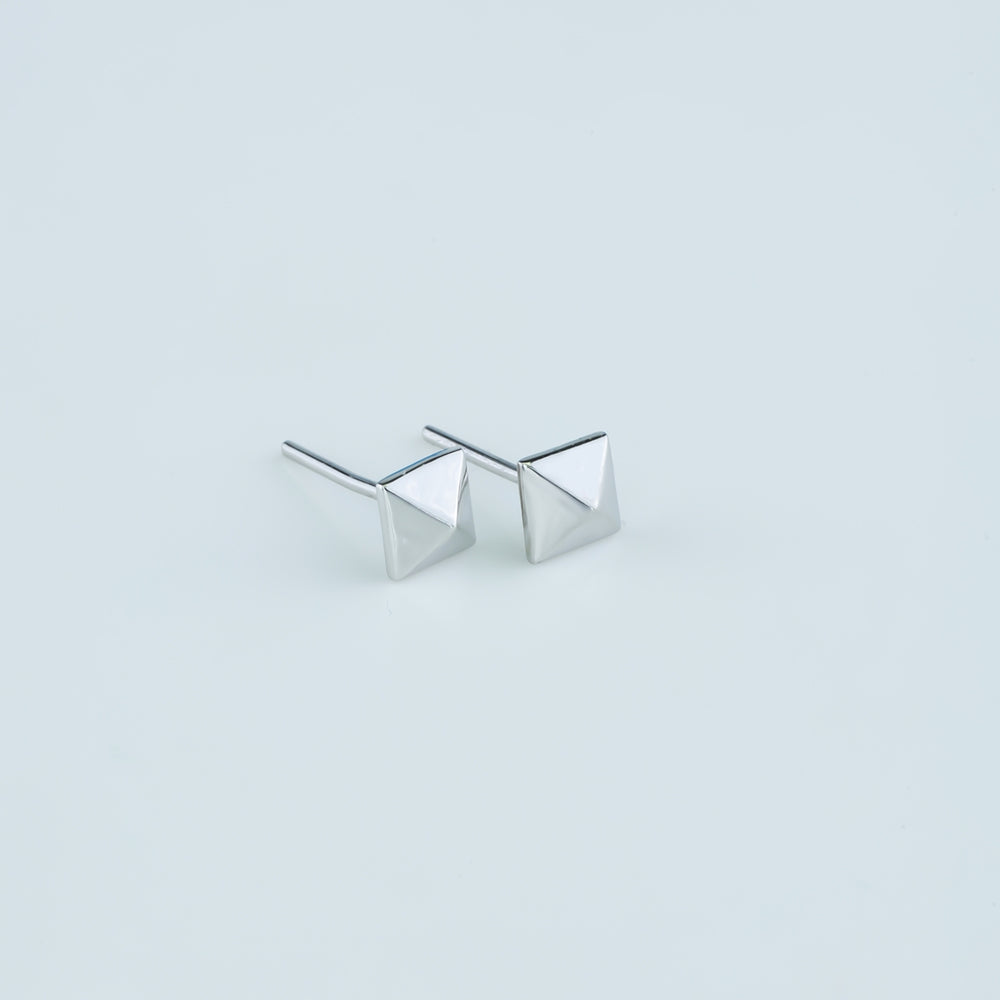 Modern pyramid stud earrings with smooth square base and raised geometric peak
