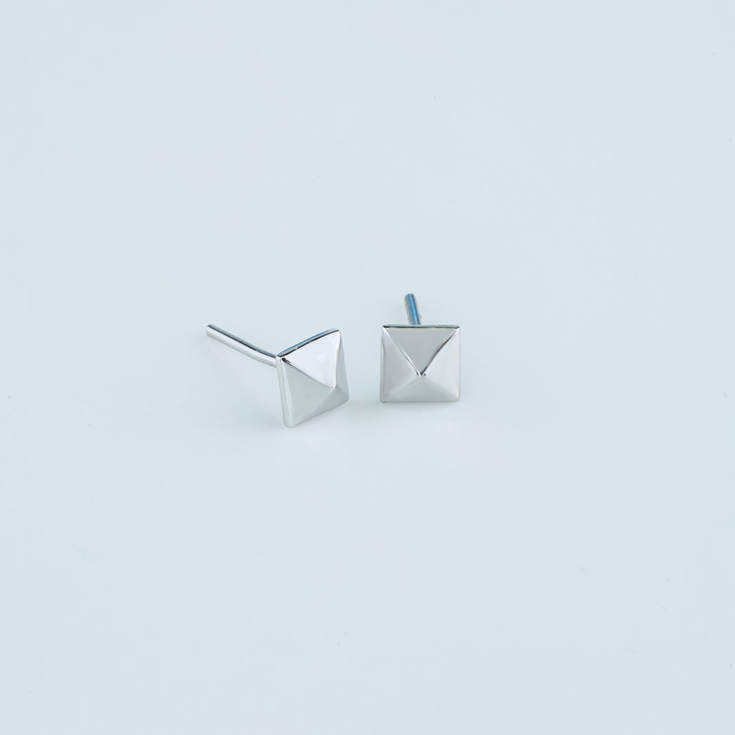 Modern pyramid stud earrings with smooth square base and raised geometric peak