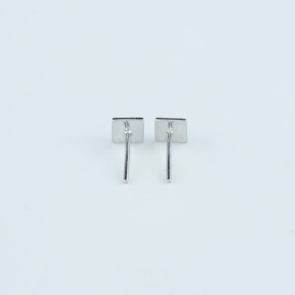 Modern pyramid stud earrings with smooth square base and raised geometric peak